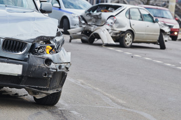 car crash accident on street, damaged automobiles after collision in city