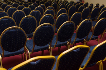 large conference room with elite blue seats, comfortable chairs, many chairs or chairs