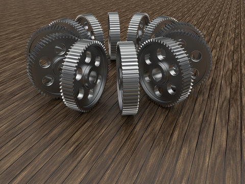 3D render - gears array on a wooden background