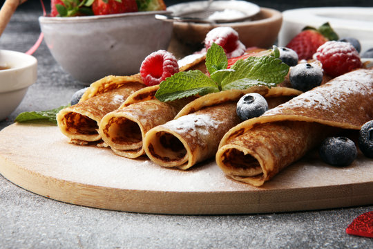 Delicious Tasty Homemade crepes or pancakes with raspberries and blueberries