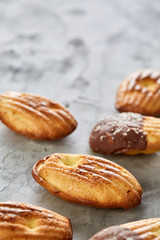 Obraz na płótnie Canvas Tasty almond cookies arranged on white background, close-up, selective focus