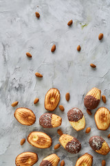 Fototapeta na wymiar Tasty almond cookies arranged on white background, close-up, selective focus