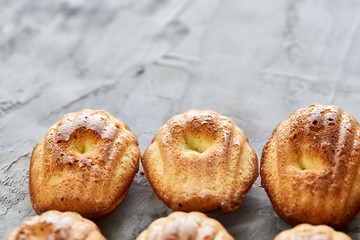 Tasty almond cookies arranged on white background, close-up, selective focus