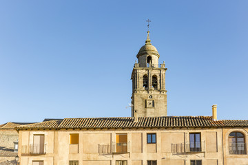 Buildings at Plaza mayor in Medinaceli town and Collegiate Church of our lady of Assumption, province of Soria, Spain