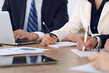 Group of business people or lawyers  at meeting, hands close-up