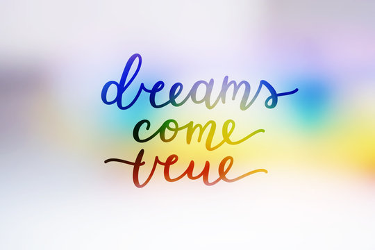 lettering on rainbow blurred background