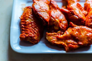 chicken wings marinated in a barbecue sauce, a typical American snack
