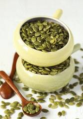 Raw pumpkin seeds in bowl
