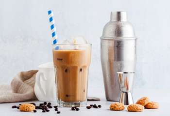 Coffee frappe in a tall glass with ice . and Amaretti cookies