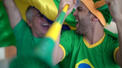 Father and Son Celebrating Brazil Victory - Powered by Adobe