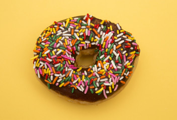 Sprinkle Donuts on a Yellow Background
