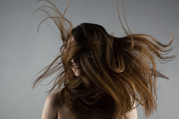 beautiful brunette girl with windy hair