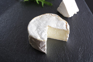 cheese brie stone background black dark