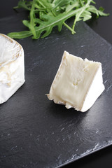cheese brie stone background black dark