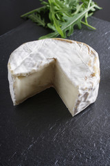 cheese brie stone background black dark