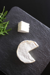 cheese brie stone background black dark