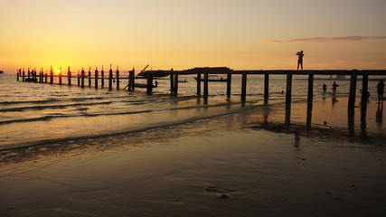 wooden jetty in the sunset