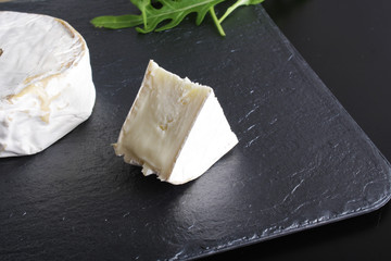 cheese brie stone background black dark
