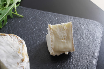 cheese brie stone background black dark