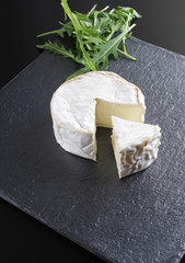 cheese brie stone background black dark