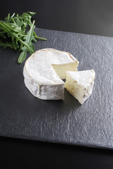 cheese brie stone background black dark