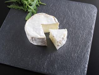 cheese brie stone background black dark