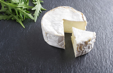 cheese brie stone background black dark