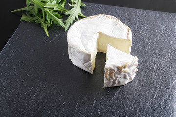 cheese brie stone background black dark