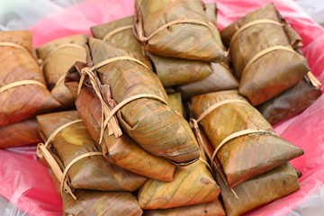 Sticky rice wrapped in banana leaves