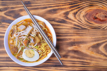 Curry Noddles or Mee Kari which is a popular traditional spicy noodle soup from the culture in Malaysia.