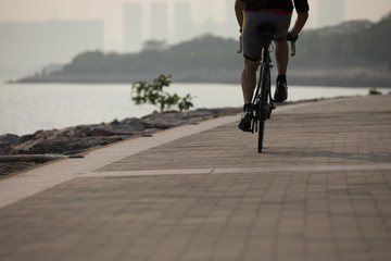cyclist riding bike on seaside