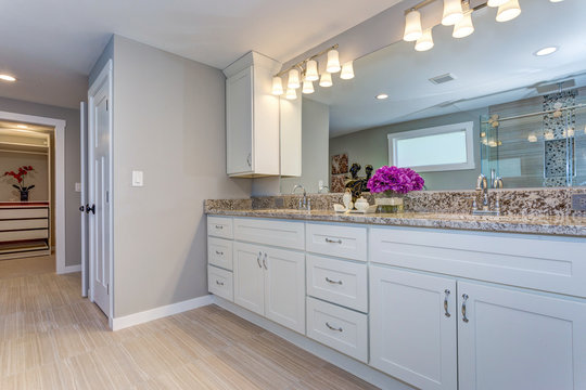 Elegant Bathroom With Long White Vanity Cabinet