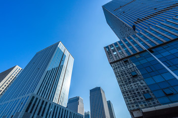 Plakat low angle view of skyscrapers in city of China.