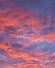 Naklejka na ściany i meble Vibrant colorful clouds at sunset
