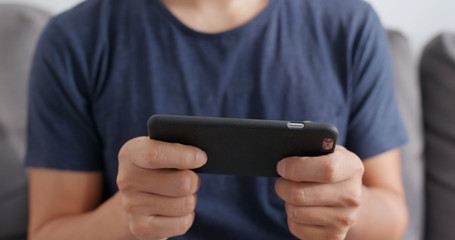 Man playing on cellphone