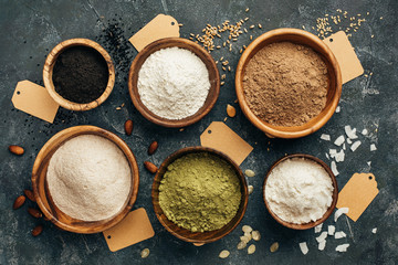 Wooden bowls of various flour.