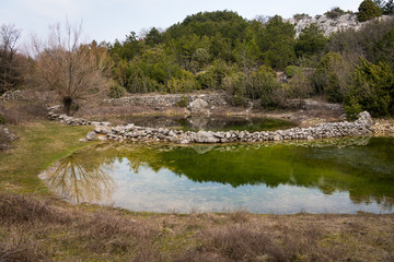Small ponds watering place for sheep in spring near Lubenice