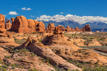 Summer scenery in Arches National Park, Utah, with red rock formations and clear blue sky