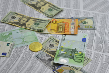 coin bitcoin lies on banknotes and sheets with numbers