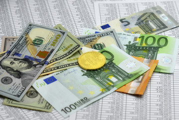 coin bitcoin lies on banknotes and sheets with numbers