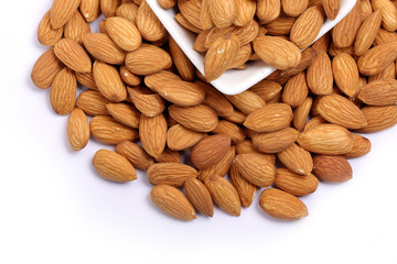 Almonds isolated. Group of almond nuts isolated on white background. Full depth of field