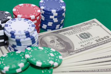 pile of poker chips and money, gambling concept