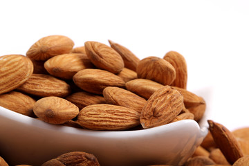 Almonds isolated. Group of almond nuts isolated on white background. Full depth of field