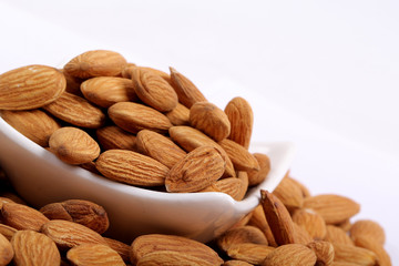 Almonds isolated. Group of almond nuts isolated on white background. Full depth of field