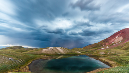 View of Tulpar Kul lake in Kyrgyzstan during the storm