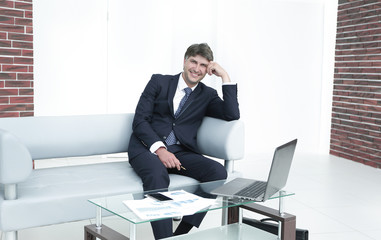 Successful businessman in modern spacious office