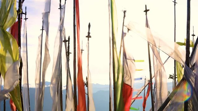 Buddhist prayer flags blowing In the wind. Shot in Bhutan.