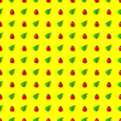 Seamless pattern with green leaves and ladybirds on a creative yellow background. Vector illustration.