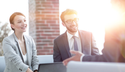 members of the business team talking to a client