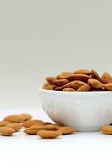 Almonds isolated. Group of almond nuts isolated on white background. Full depth of field